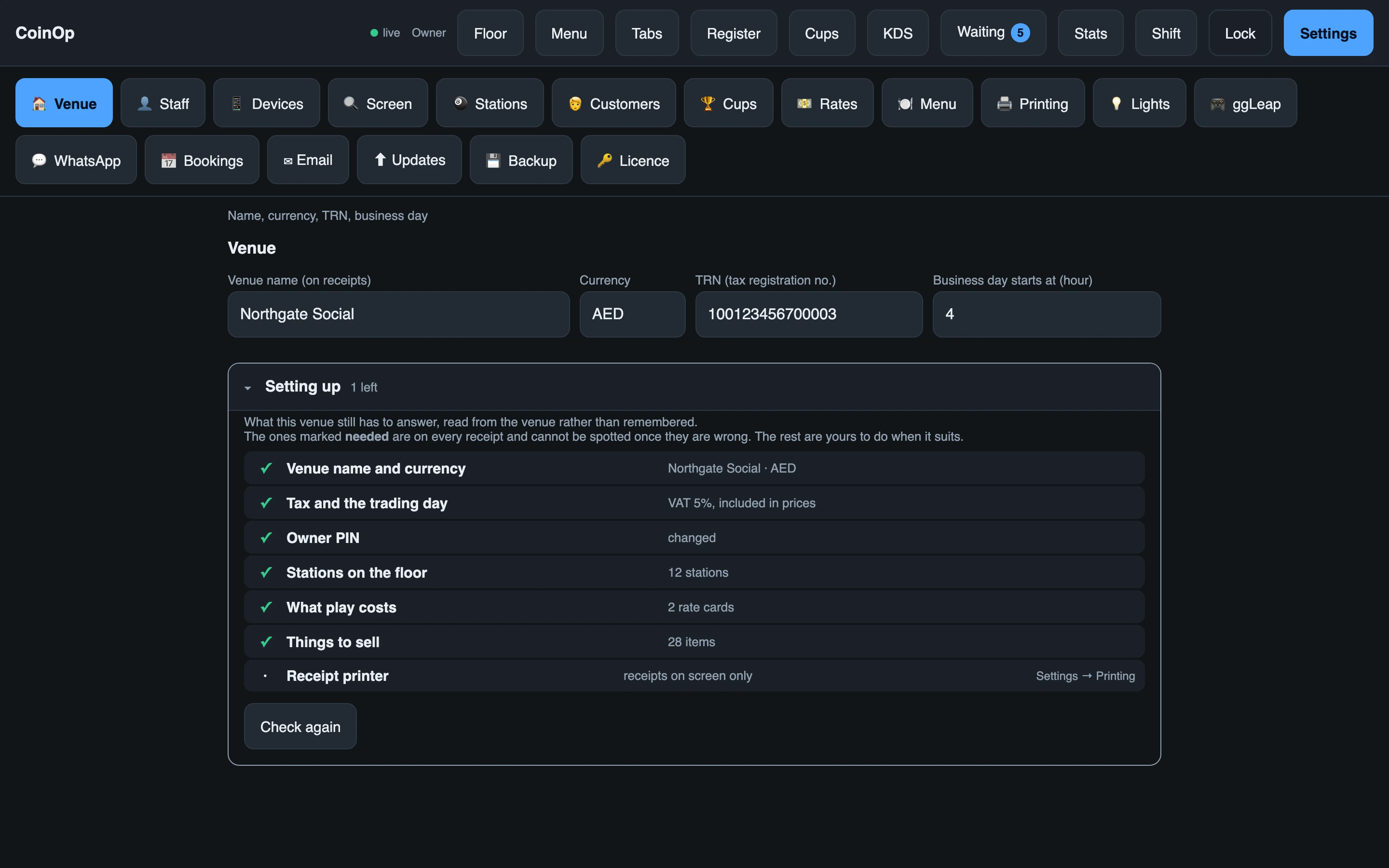 The venue settings page: name, TRN, service charge and the hour the business day starts
